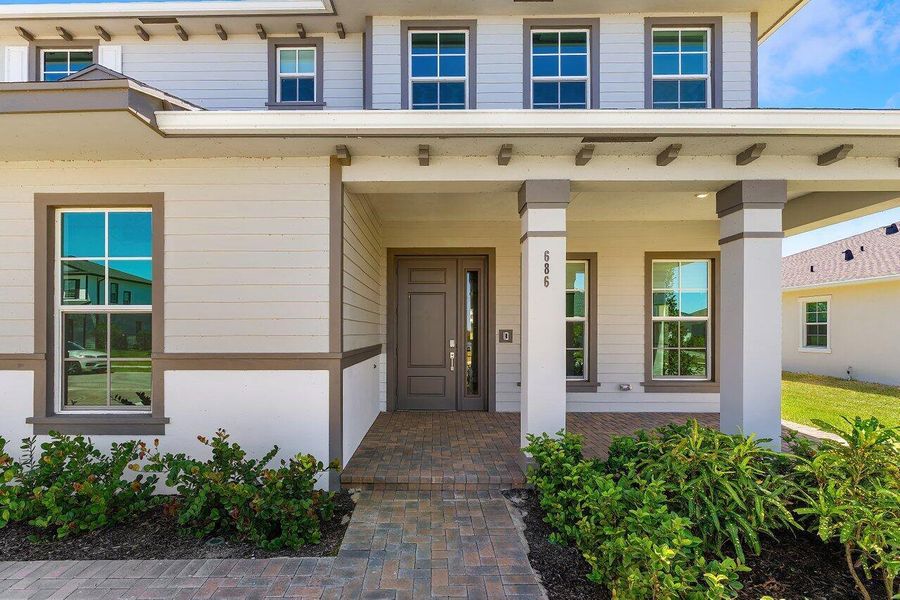 Front exterior of a new home in , Loxahatchee, FL, highlighting curb appeal (Image 26).