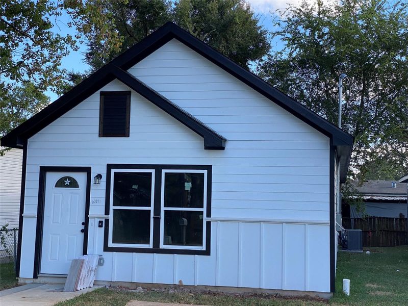 Actual house with double driveway and back porch Actual house with double driveway and back porch