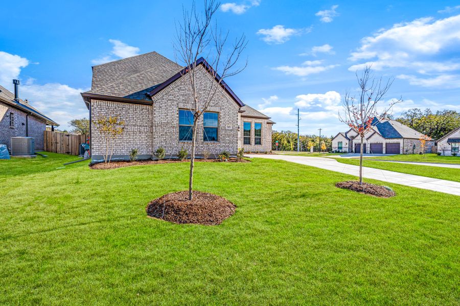 Front exterior of a new home in Forest Ridge Estates, Greenville, TX, highlighting curb appeal (Image 21). Front exterior of a new home in Forest Ridge Estates, Greenville, TX, highlighting curb appeal (Image 21).