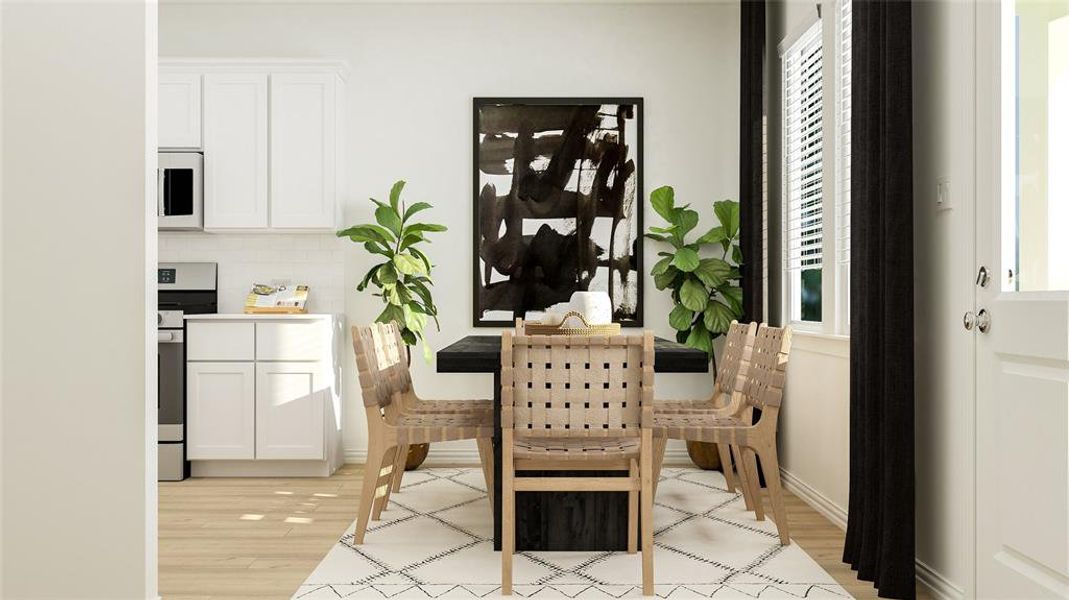 Dining room with light hardwood / wood-style flooring