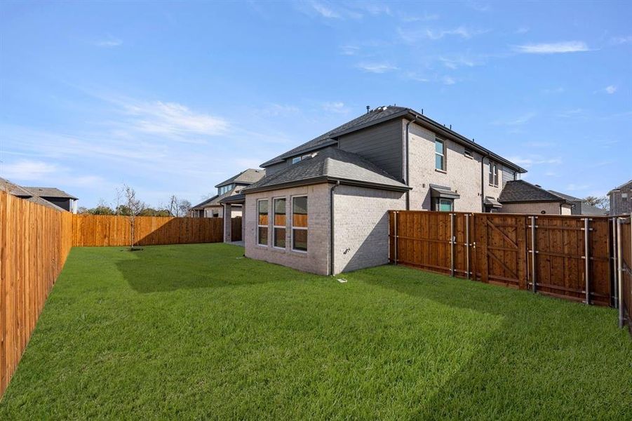 Exterior details and patio area of a home in Valencia on The Lake, Little Elm (Image 4).