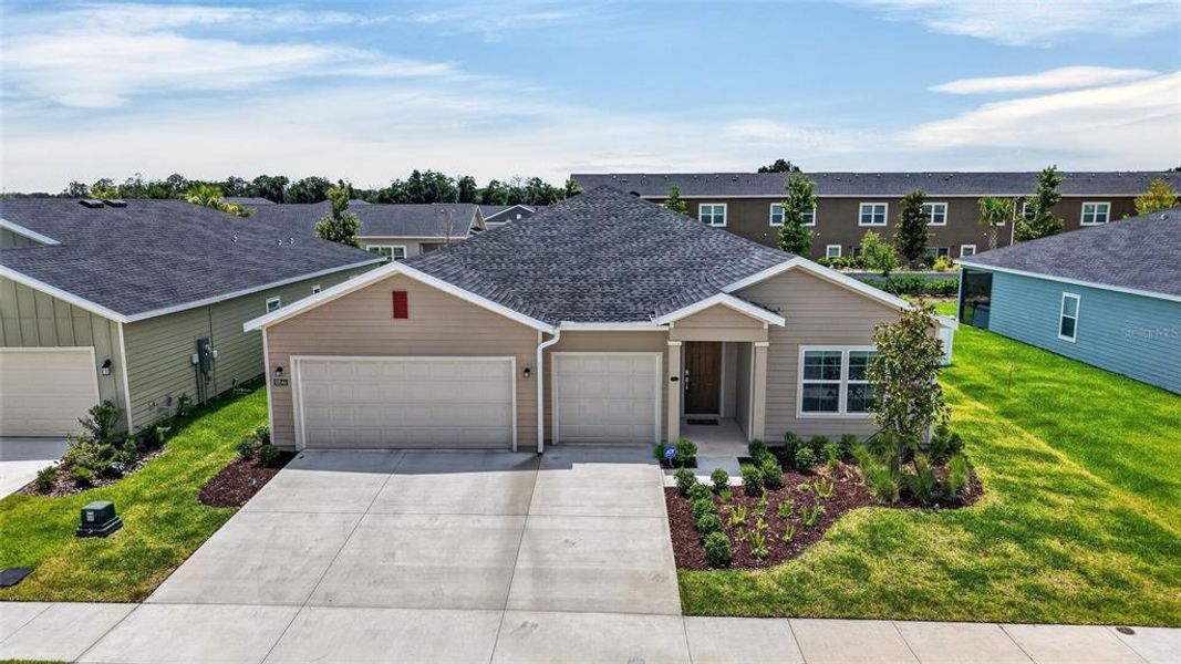 Front exterior of a new home in Pioneer Ranch, Ocala, FL, highlighting curb appeal (Image 1). Front exterior of a new home in Pioneer Ranch, Ocala, FL, highlighting curb appeal (Image 1).