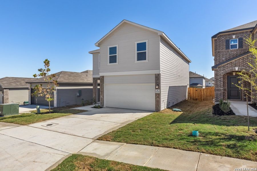 Front exterior of a new home in Knox Ridge, Converse, TX, highlighting curb appeal (Image 2). Front exterior of a new home in Knox Ridge, Converse, TX, highlighting curb appeal (Image 2).