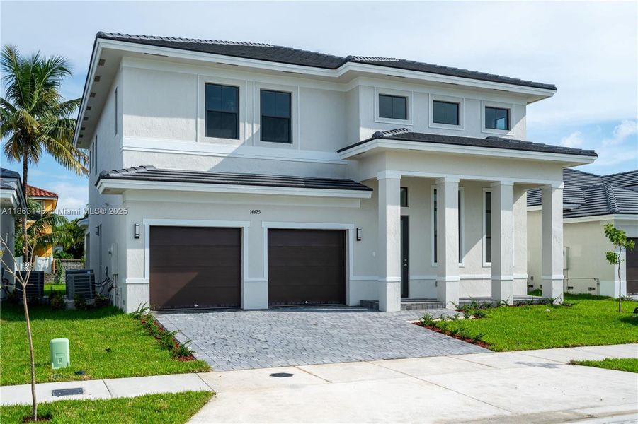 Front exterior of a new home in , Miami, FL, highlighting curb appeal (Image 14).