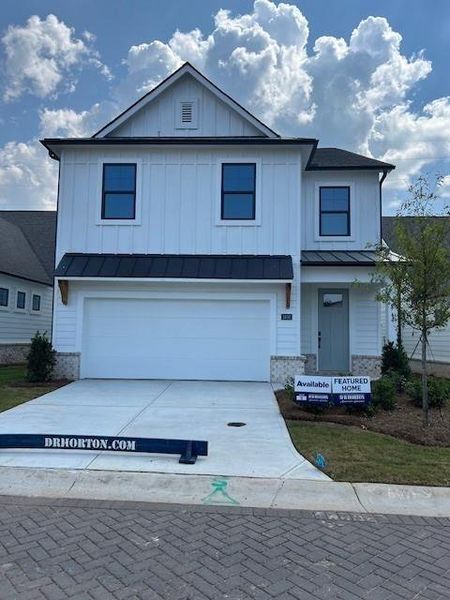 Front exterior of a new home in The Village at Sandy Plains, Marietta, GA, highlighting curb appeal (Image 16).