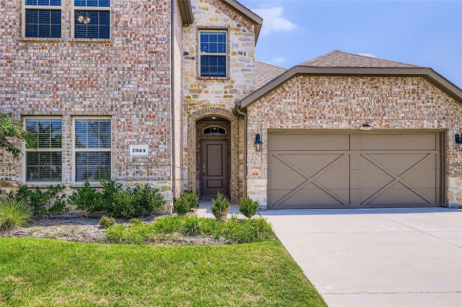 Front exterior of a new home in , Little Elm, TX, highlighting curb appeal (Image 27).