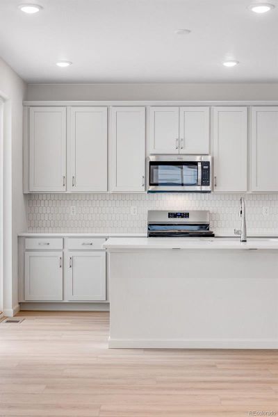 Furnished interior view inside a new home in Reunion, Commerce City (Image 5).