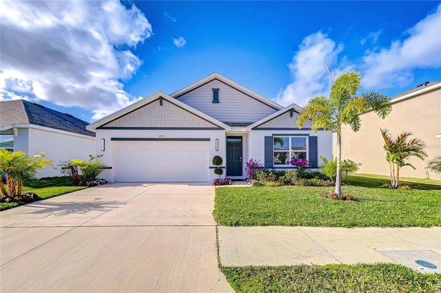 Front exterior of a new home in , Zephyrhills, FL, highlighting curb appeal (Image 24). Front exterior of a new home in , Zephyrhills, FL, highlighting curb appeal (Image 24).