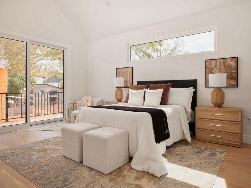Bedroom with light wood-style floors, access to exterior, and lofted ceiling Bedroom with light wood-style floors, access to exterior, and lofted ceiling