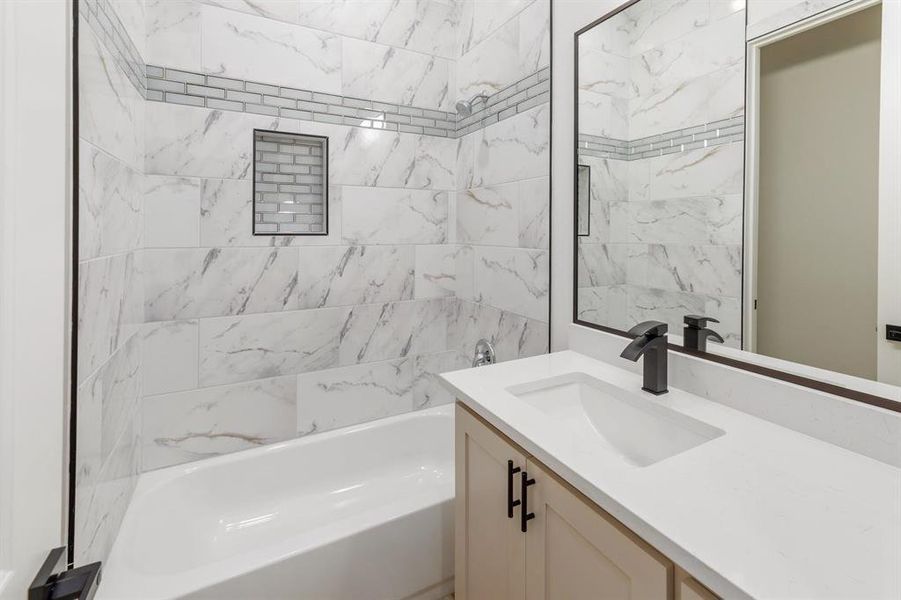 Full bathroom with vanity and shower / tub combination