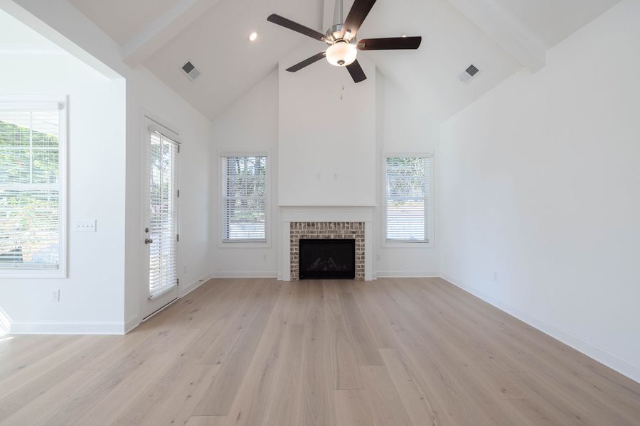 Family room with elevated ceiling height and walls of windows