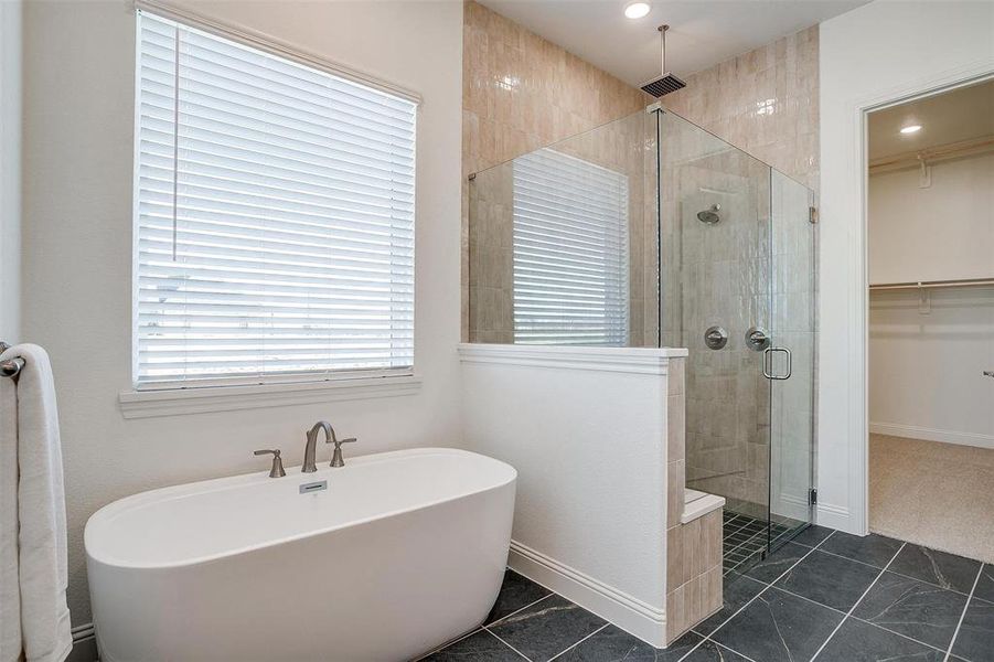 Bathroom with separate shower and tub and tile flooring