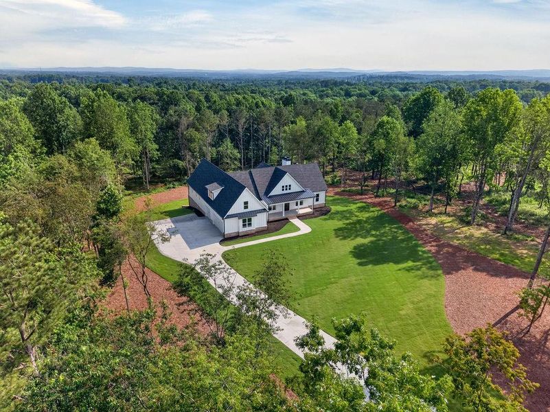 Front exterior of a new home in , Fairmount, GA, highlighting curb appeal (Image 33). Front exterior of a new home in , Fairmount, GA, highlighting curb appeal (Image 33).