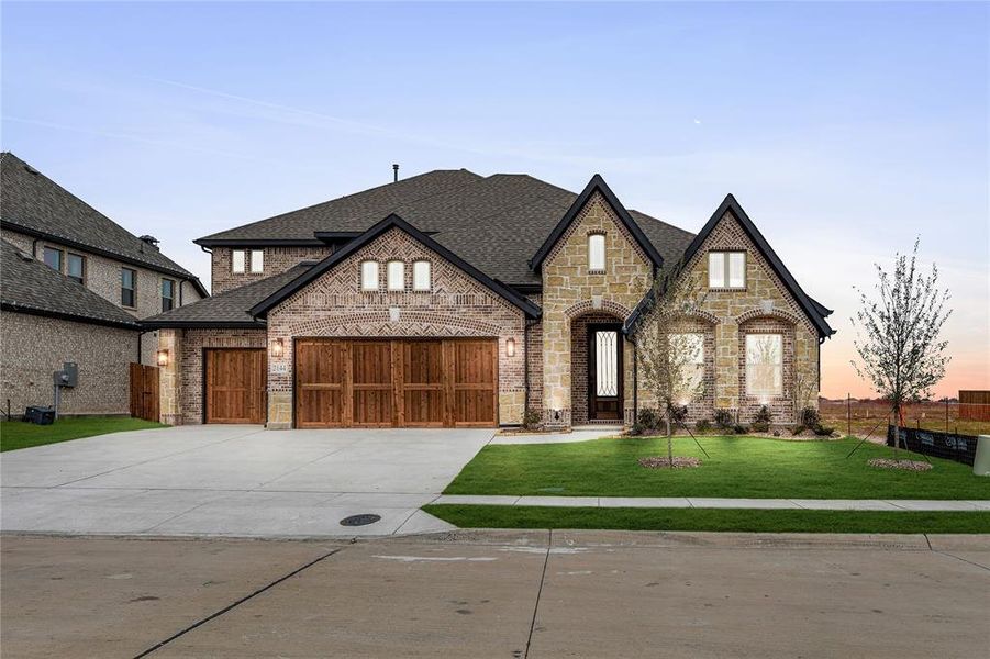 Front exterior of a new home in Stone River Glen 60s, Royse City, TX, highlighting curb appeal (Image 2).