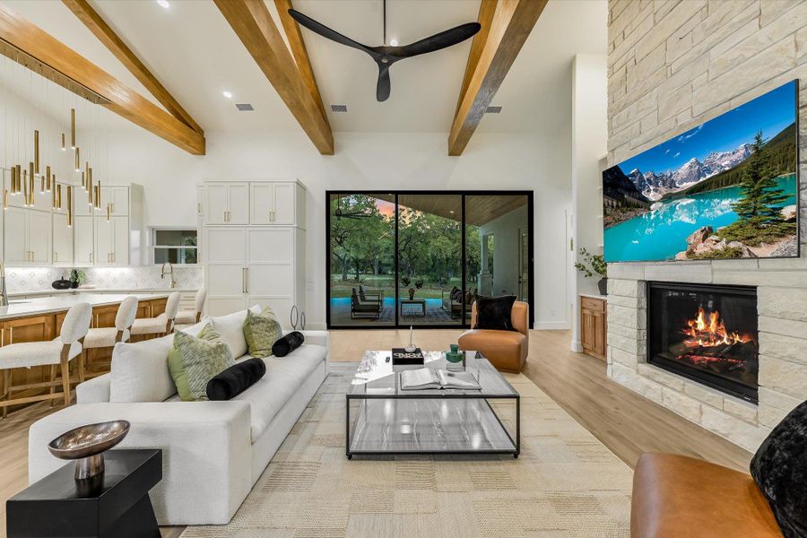 Living room with a fireplace, recessed lighting, and light wood finished floors