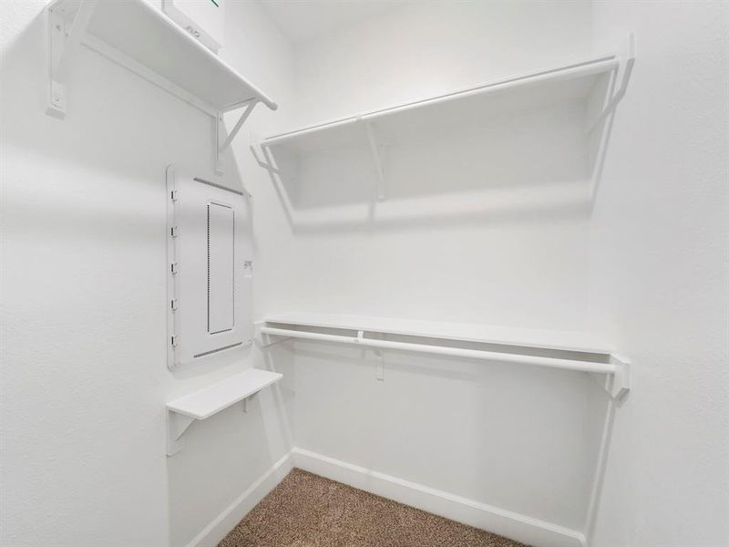 The second bedroom's spacious walk-in closet! (Sample photos of a completed Warwick floor plan. The image may feature alternative selections and/or upgrades.)