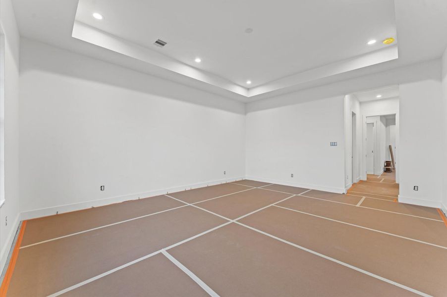 Another view of the primary bedroom with 11 ft ceilings.