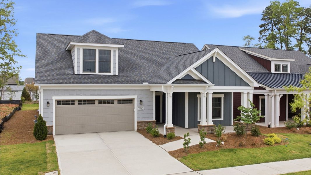 Front exterior of a new home in The Courtyards at Oak Grove, Durham, NC, highlighting curb appeal (Image 20).