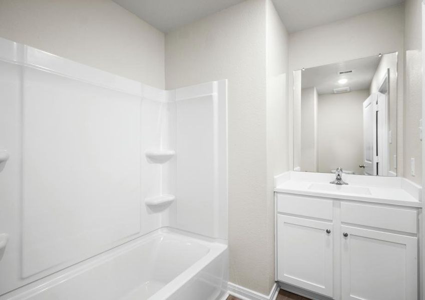 The secondary bedroom with a tub/shower combination.