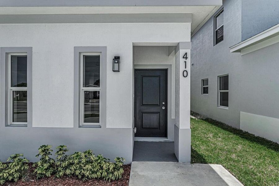 Front exterior of a new home in , Boynton Beach, FL, highlighting curb appeal (Image 14).