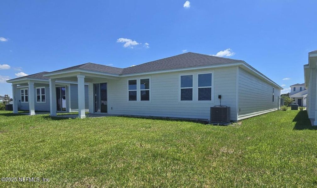 Front exterior of a new home in Lakes at Bella Lago - Signature Series, Green Cove Springs, FL, highlighting curb appeal (Image 19).