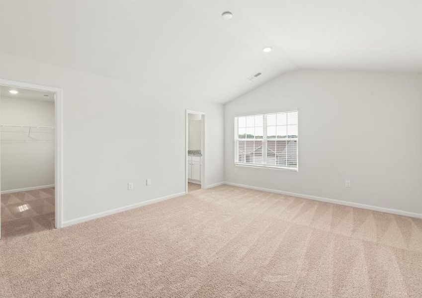 Master bedroom with carpet.