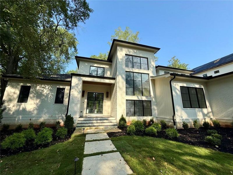 Front exterior of a new home in , Sandy Springs, GA, highlighting curb appeal (Image 27).