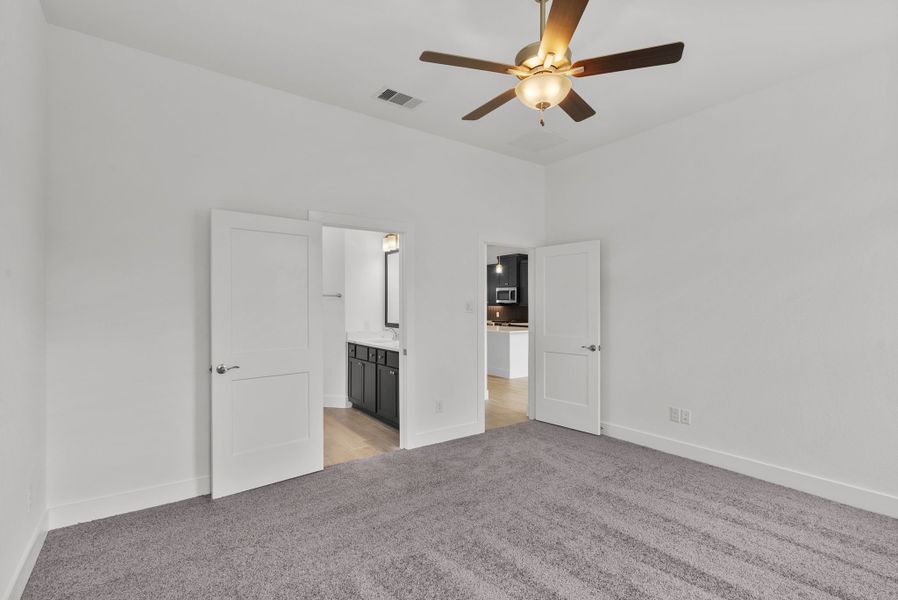 Representative unfurnished interior of a home built from the Carlisle by Chesmar Homes in Sunterra, Katy (Image 9).