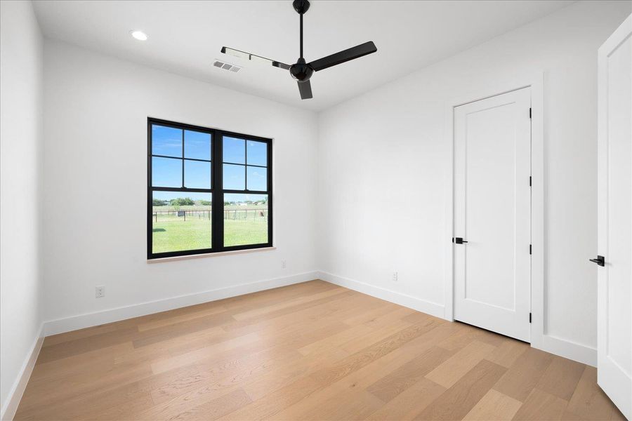 Spare room with ceiling fan, light wood-type flooring, baseboards, and recessed lighting