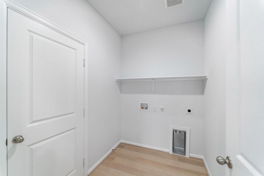 Laundry room with gas dryer hookup, light wood-style floors, hookup for a washing machine, and electric dryer hookup
