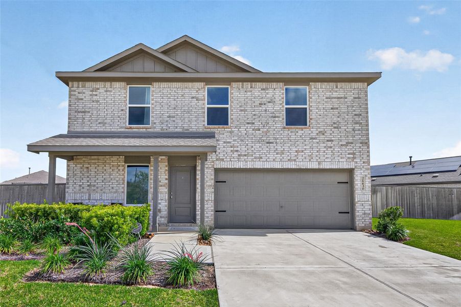 Front exterior of a new home in Anniston, Katy, TX, highlighting curb appeal (Image 20).