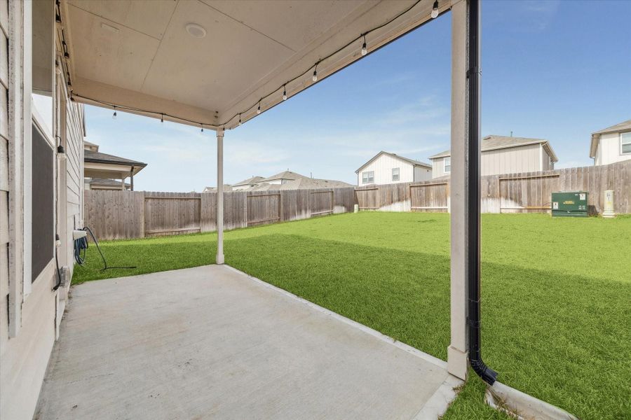 Large covered patio and generous backyard Large covered patio and generous backyard