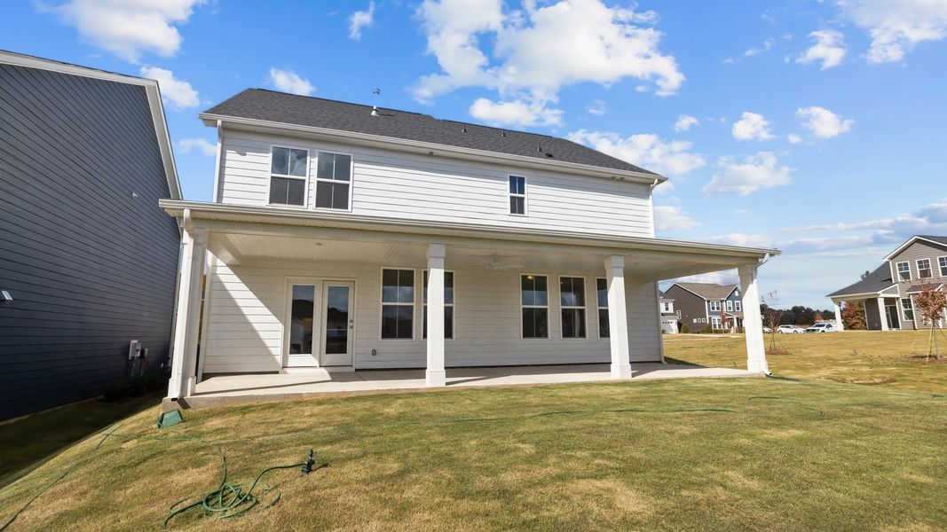 Burton Design large rear covered porch at Lakeside Glen by premier builder DRB Homes in York, SC.