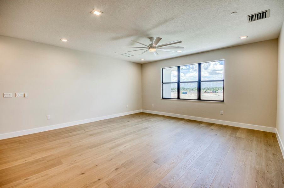 Furnished interior view inside a new home in Apex at Avenir, Palm Beach Gardens (Image 41).