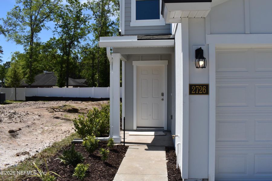 Exterior details and patio area of a home in Irongate Villas, Jacksonville (Image 2).