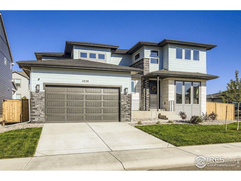 Front exterior of a new home in , Timnath, CO, highlighting curb appeal (Image 21).
