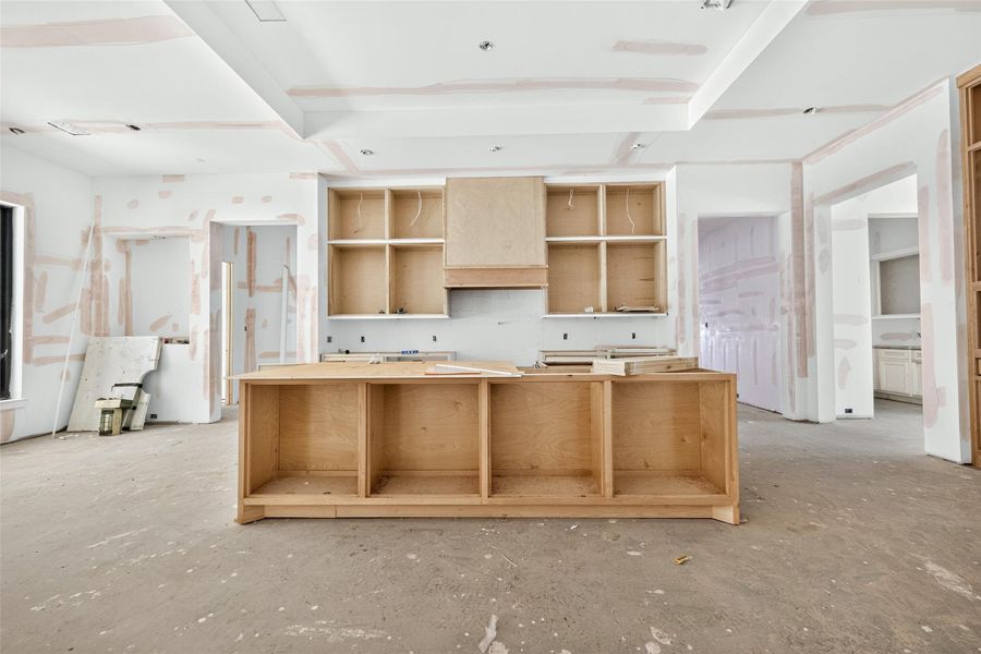 Kitchen island doubles as a breakfast bar as it can accommodate seating for 5. Vent hood will be plastered for an elegant finish