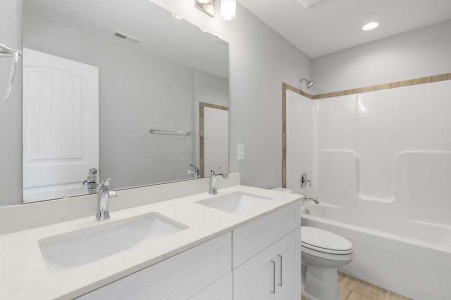 Representative furnished interior of a home built from the Drayton by Caviness & Cates Communities in Bartlett Manor, Youngsville (Image 56).