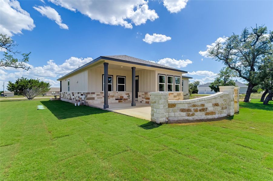 Front exterior of a new home in , Bertram, TX, highlighting curb appeal (Image 22).