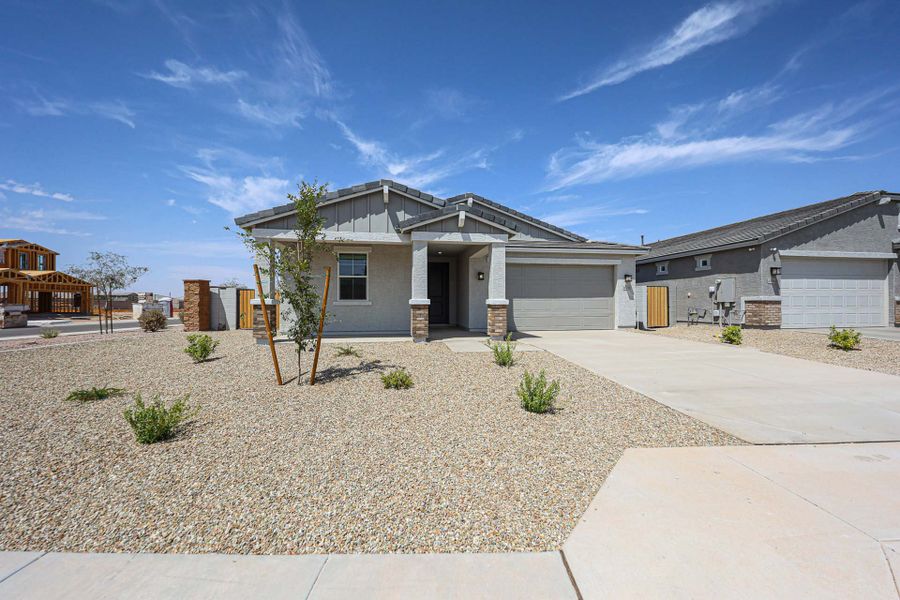 Front exterior of a new home in The Lakes at Rancho El Dorado, Maricopa, AZ, highlighting curb appeal (Image 1). Front exterior of a new home in The Lakes at Rancho El Dorado, Maricopa, AZ, highlighting curb appeal (Image 1).