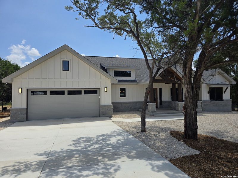 Front exterior of a new home in , Canyon Lake, TX, highlighting curb appeal (Image 33).