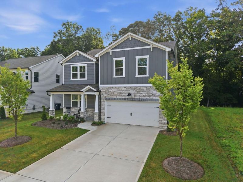 Front exterior of a new home in Cambridge at Steels Bridge, Canton, GA, highlighting curb appeal (Image 22).