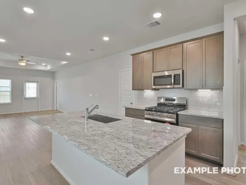 Furnished interior view inside a new home in Caney Creek Place, Conroe (Image 11).