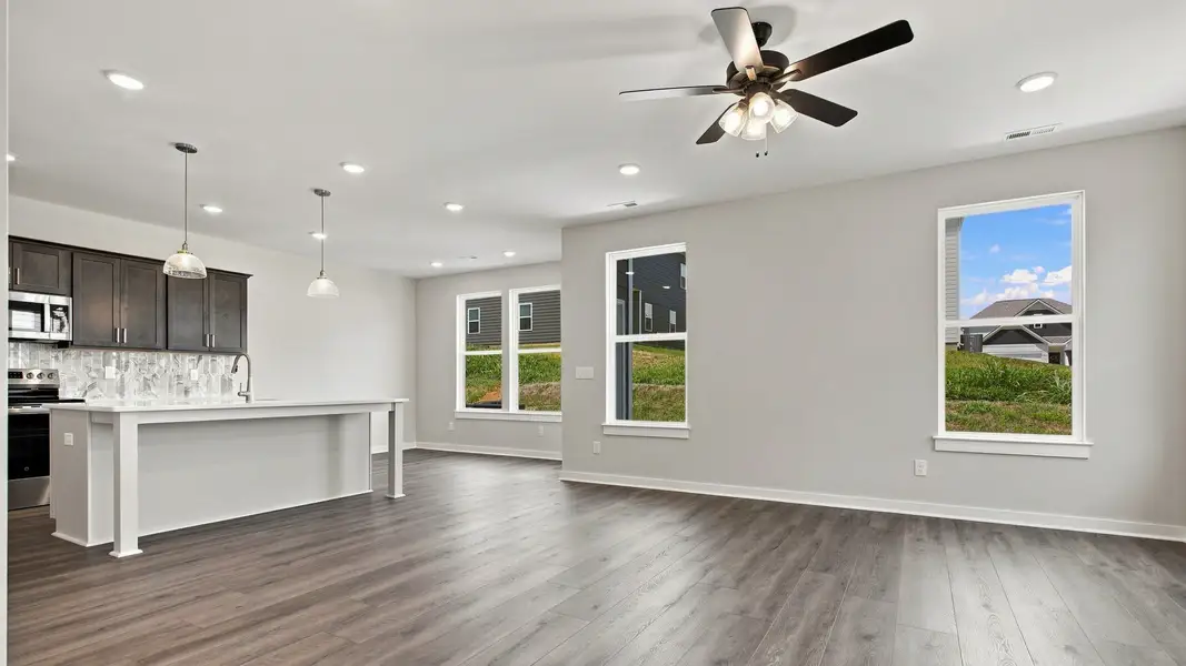 Spacious living/dining area by kitchen space