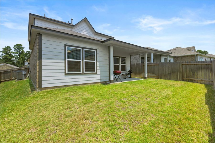 Front exterior of a new home in Lakes at Black Oak, Magnolia, TX, highlighting curb appeal (Image 23).