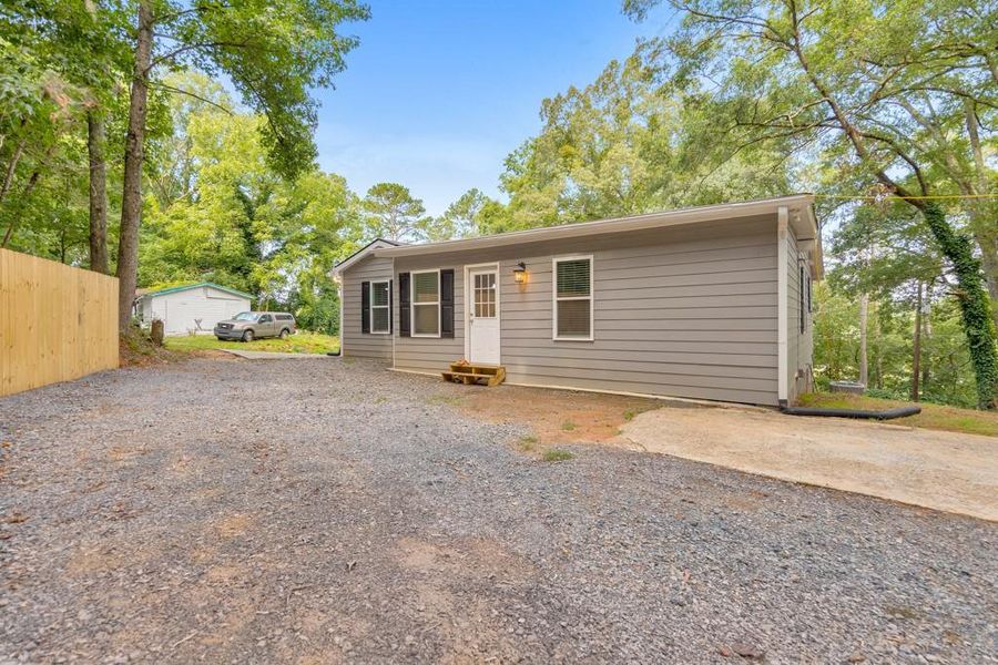 Front exterior of a new home in , Silver Creek, GA, highlighting curb appeal (Image 23). Front exterior of a new home in , Silver Creek, GA, highlighting curb appeal (Image 23).