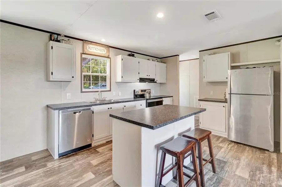Furnished interior view inside a new home in , Weirsdale (Image 10).