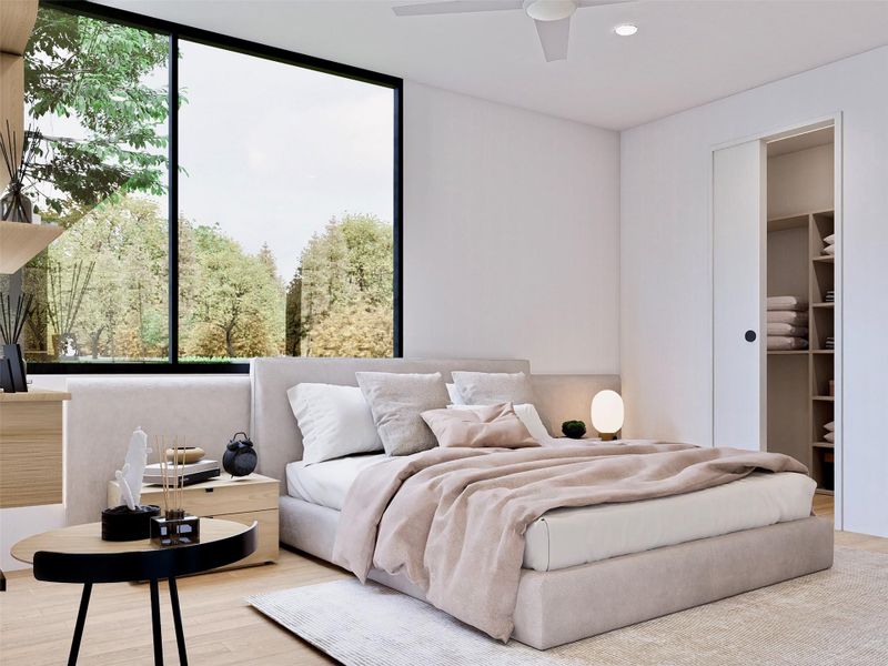 Bedroom featuring wood finished floors, a ceiling fan, recessed lighting, and a spacious closet