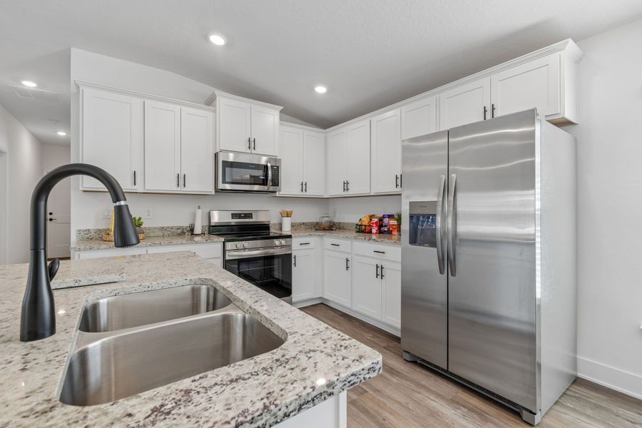 Representative furnished interior of a home built from the 1515 by Adams Homes in Winding Oaks, Weeki Wachee (Image 11).