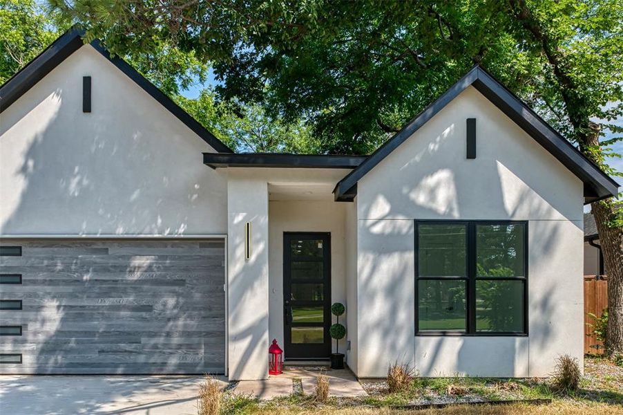 Front exterior of a new home in , Dallas, TX, highlighting curb appeal (Image 25).